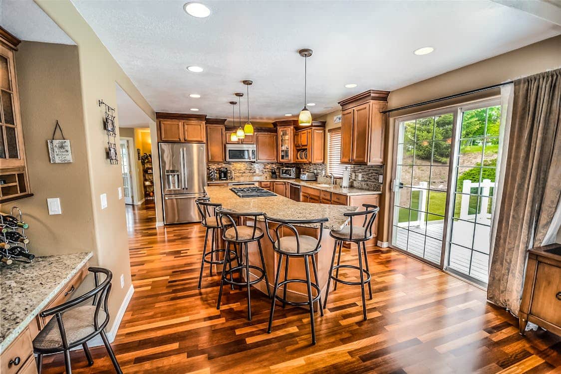 Beautiful street in a classic Atlanta neighborhood like Virginia-Highland or Buckhead, with charming homes under a bright,...