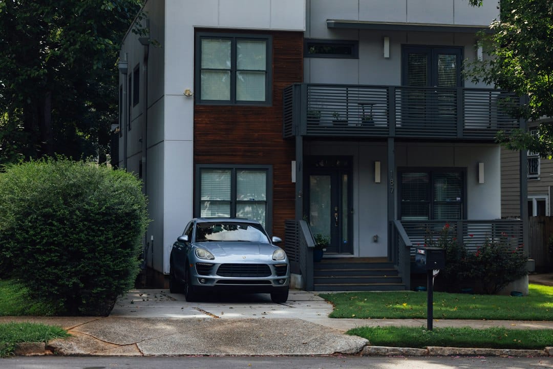 Beautiful exterior of a modern home in Atlanta on a sunny day, representing the local real estate market for the 1% commis...